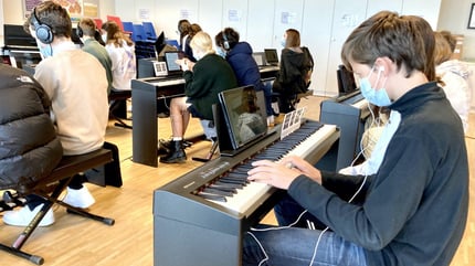 Year 10 Students playing piano at ISL